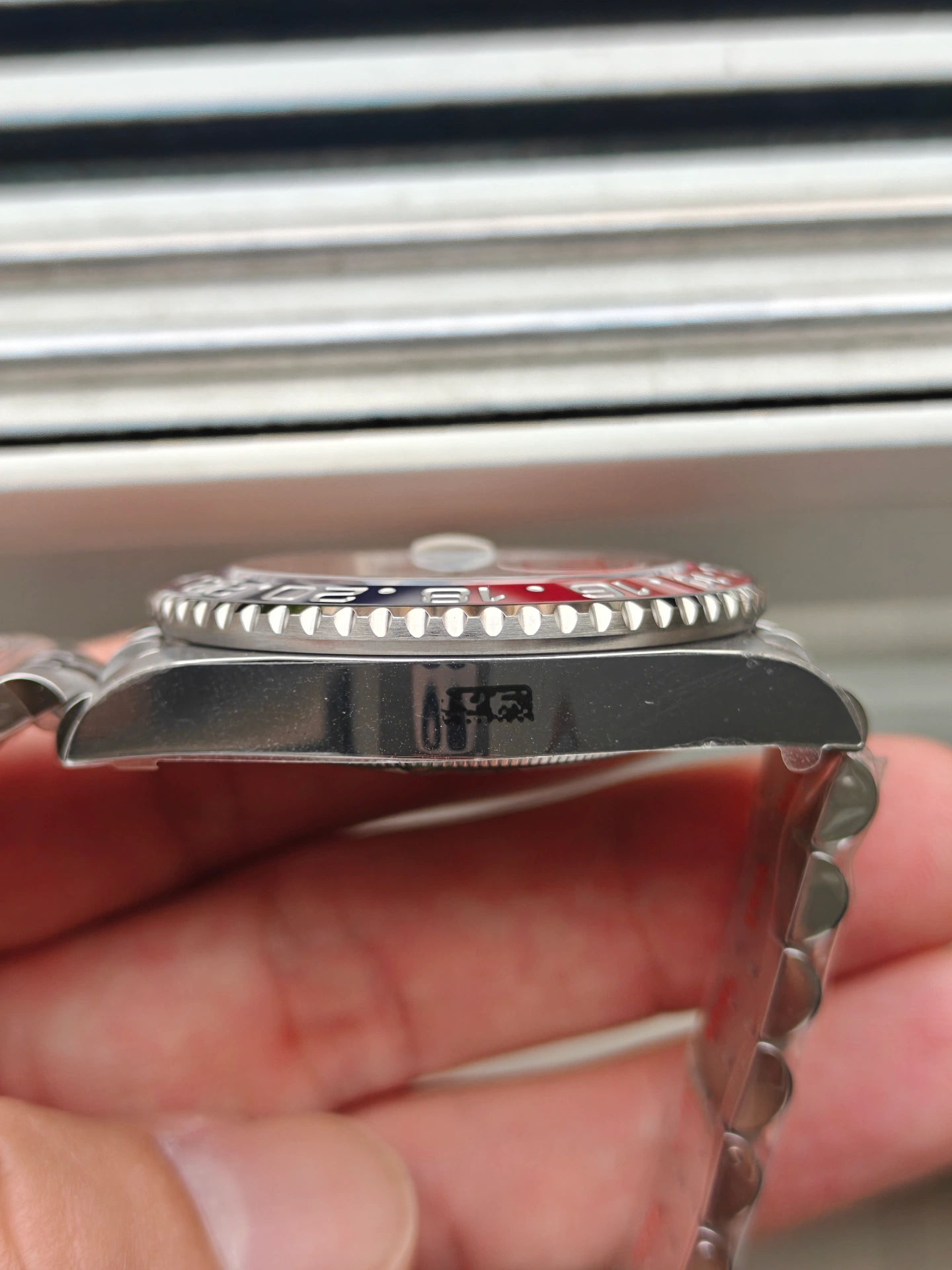 VSF Pepsi GMT-Master II case side at 9 o'clock position showing case engravings