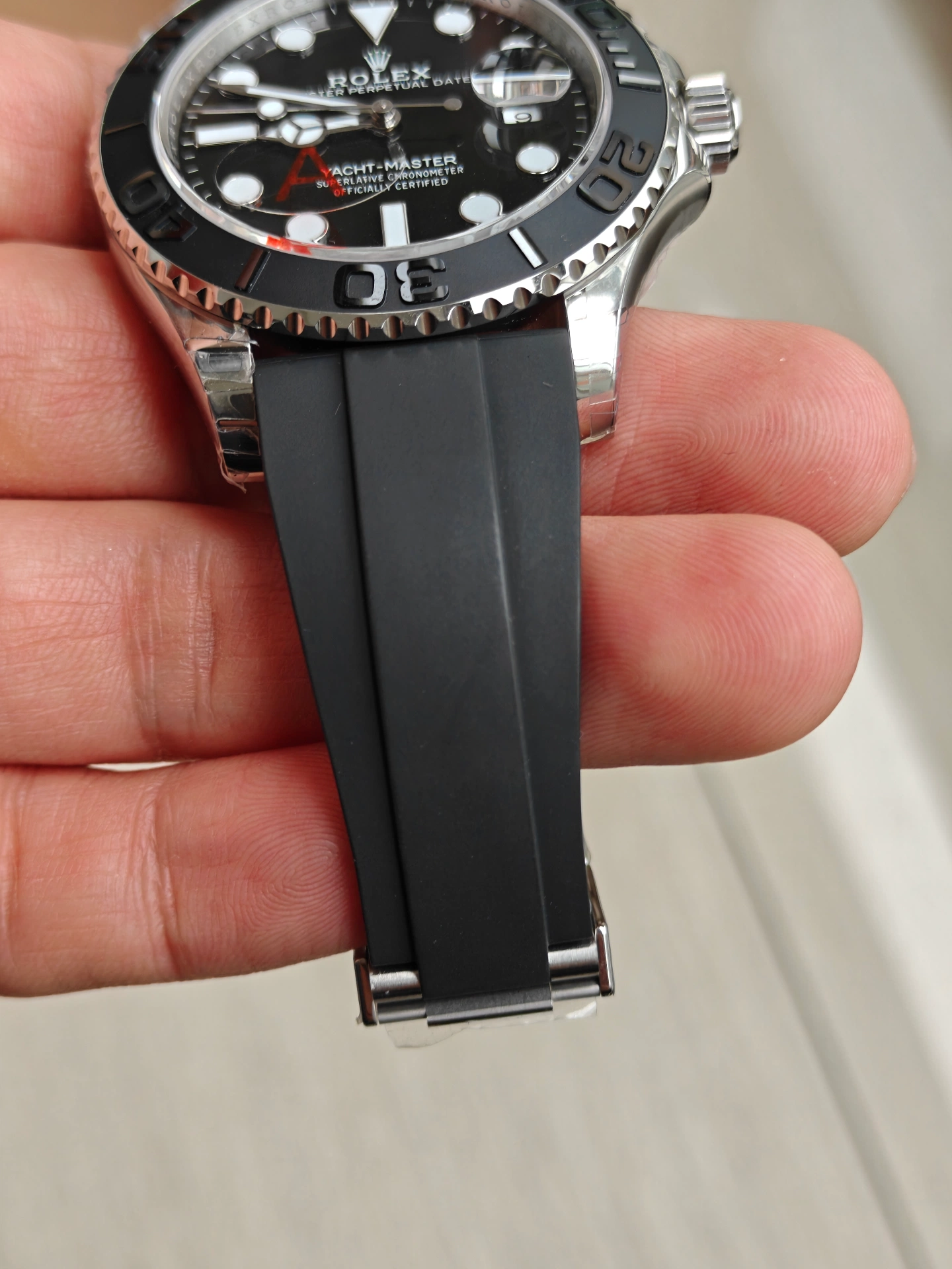 VSF White Gold Yacht-Master 42 weighted version front held view black ceramic bezel