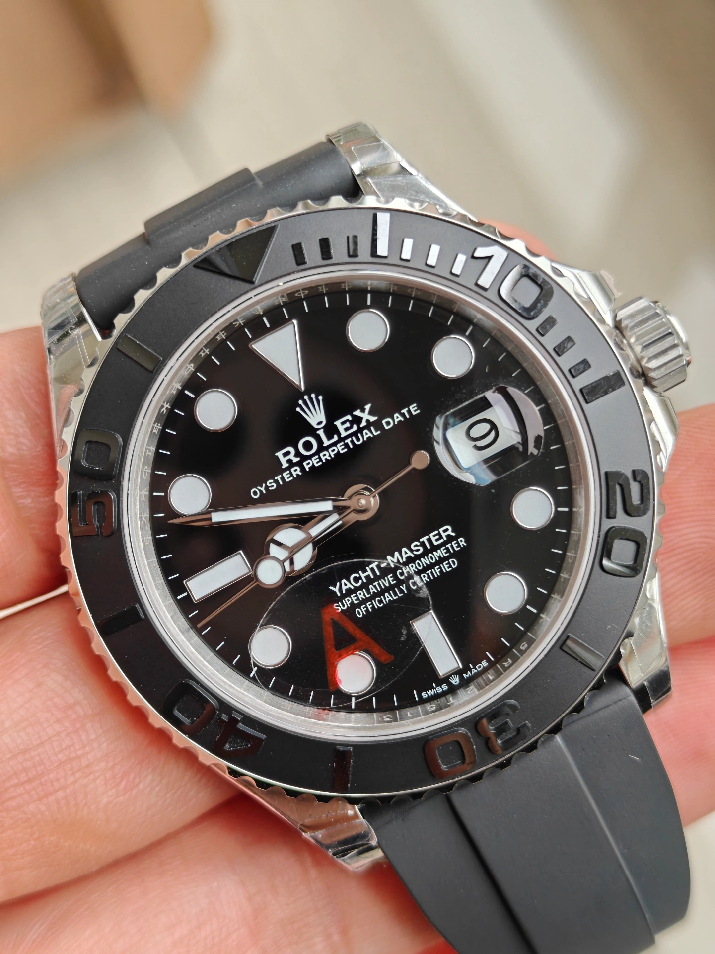 VSF White Gold Yacht-Master 42 dial closeup black dial luminous markers red A sticker