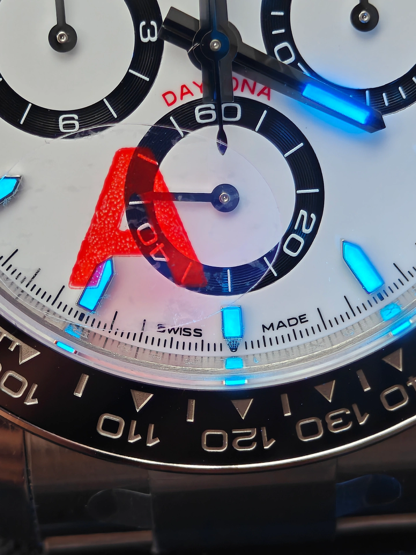 VSF V3 Panda Daytona 126500LN 6 oclock coronet closeup with lume effect red A sticker and SWISS MADE third generation identifier