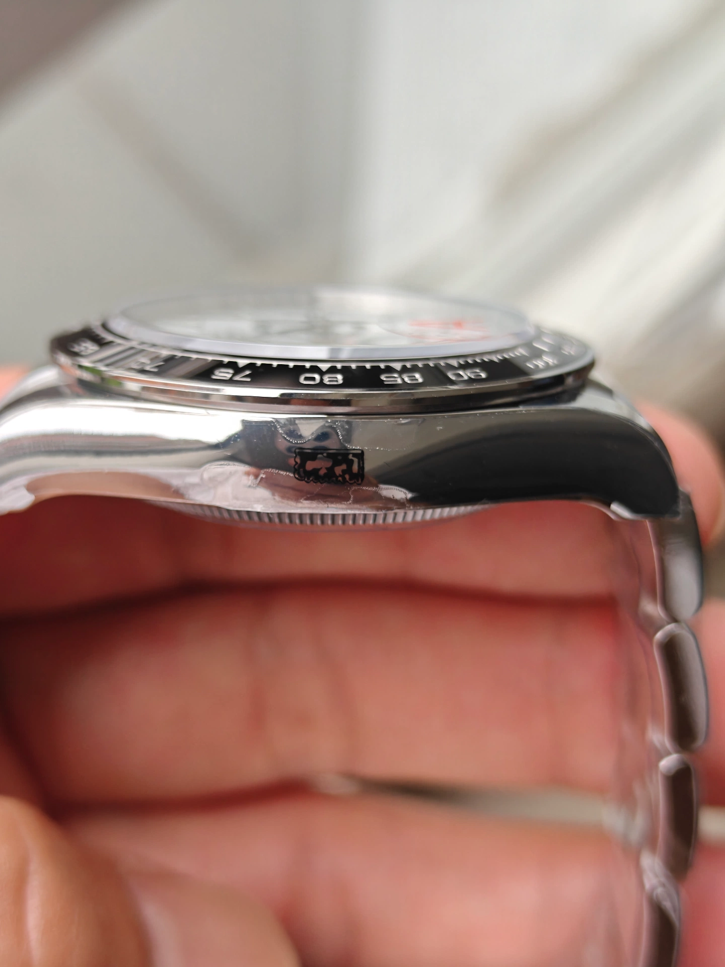 VSF V3 Panda Daytona 126500LN case side closeup showing ceramic bezel metal protective rim and case side crown engraving