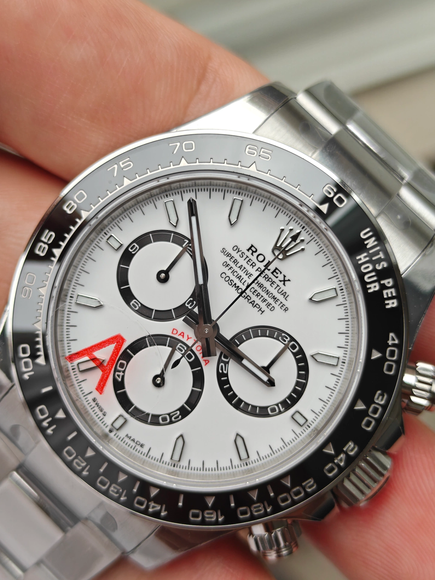 VSF V3 Panda Daytona 126500LN dial angle view showing 3D embossed red DAYTONA text and ceramic bezel metal protective rim