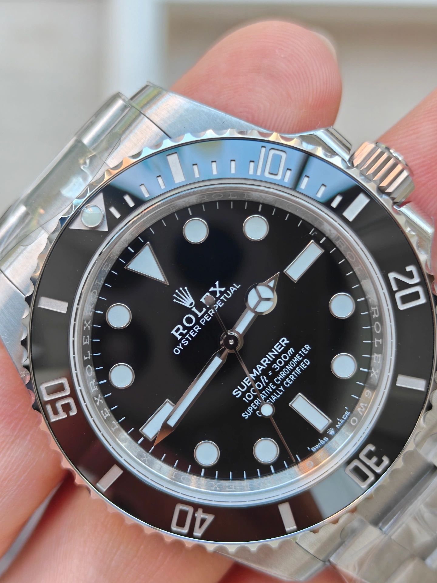 VSF Submariner lunette céramique et point lumineux gros plan, rotation nette