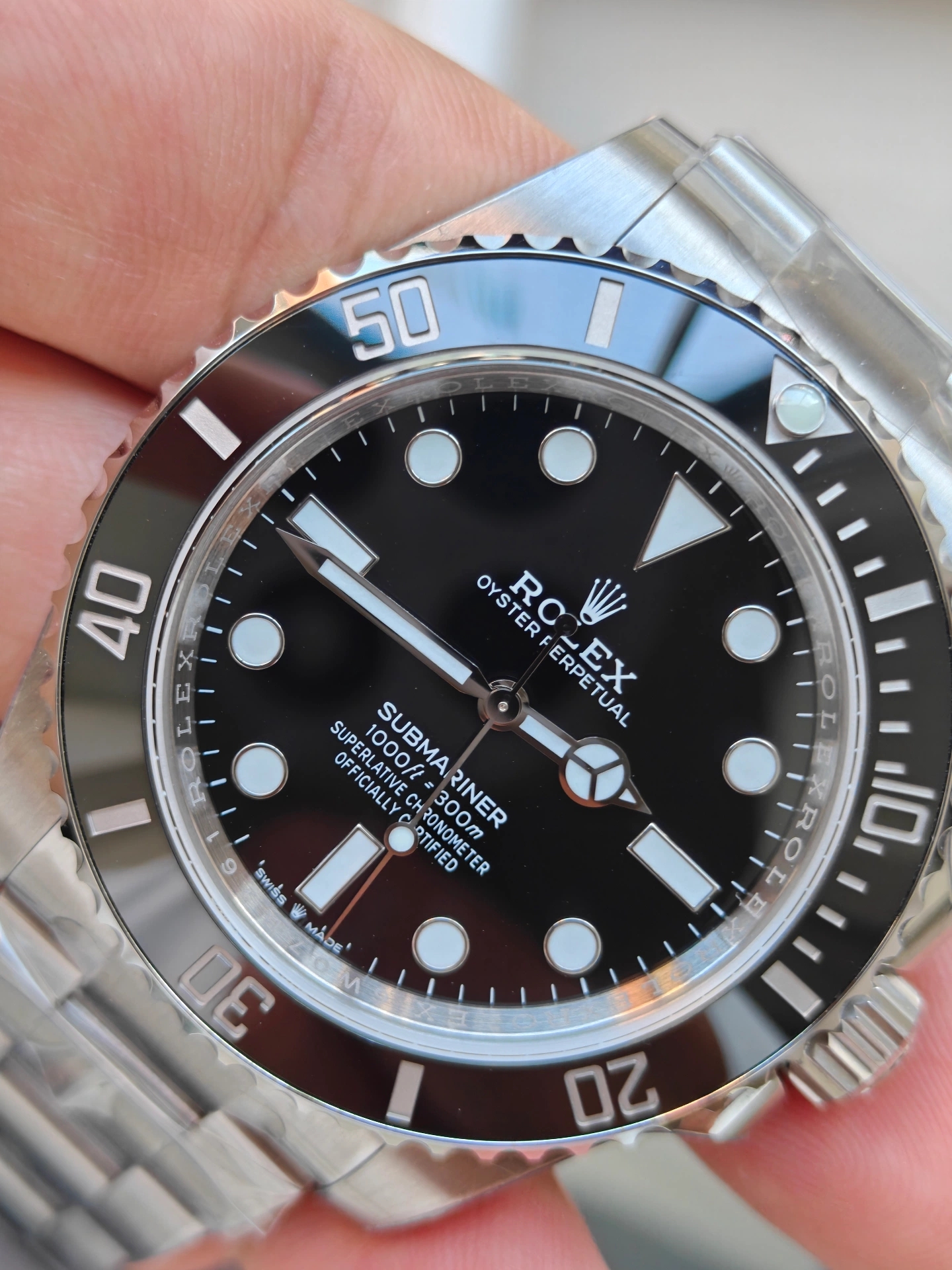 VSF Submariner cadran gros plan 45 degrés, police huilée effet 3D